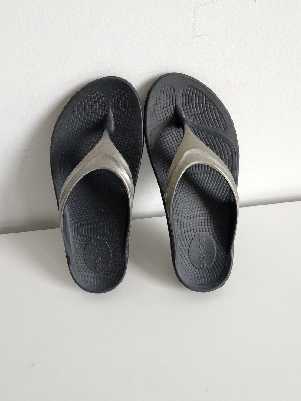 Oofos Black & Metallic Silver Flip Flop Sandals